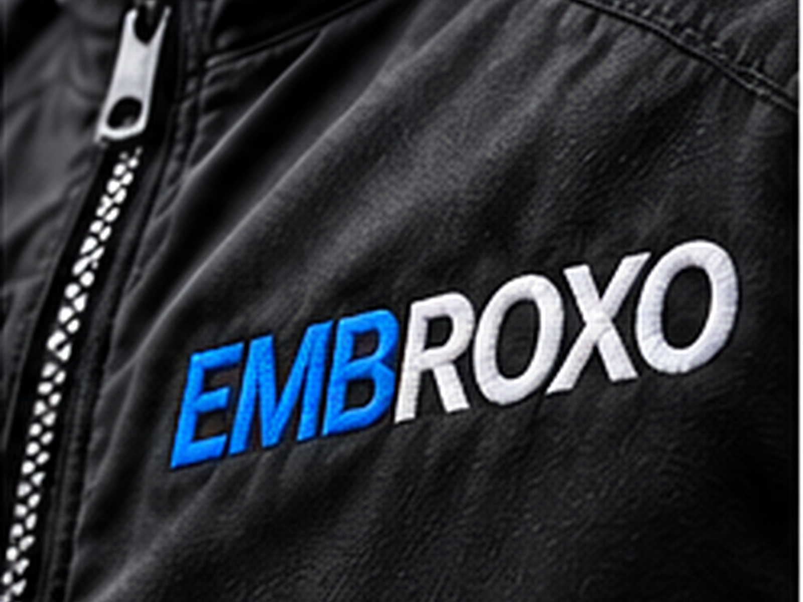 Close-up of EMBROXO embroidery on a black jacket