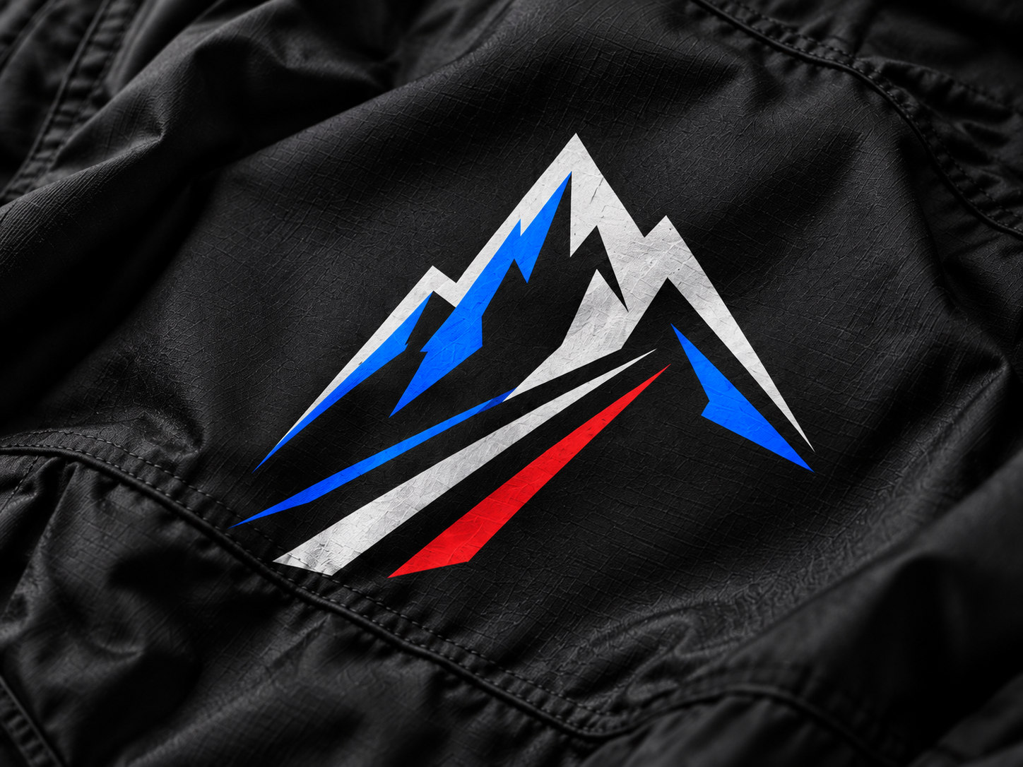 Sharp blue, white and red mountain vector graphic printed on black fabric